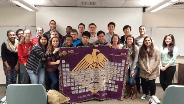 ACS Student Chapter members holding the chapter blanket at the ACS national meeting in Boston